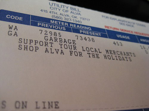 City utility bill with a "shop local" message.