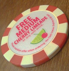 Poker chip says, "free medium cherry limeade."