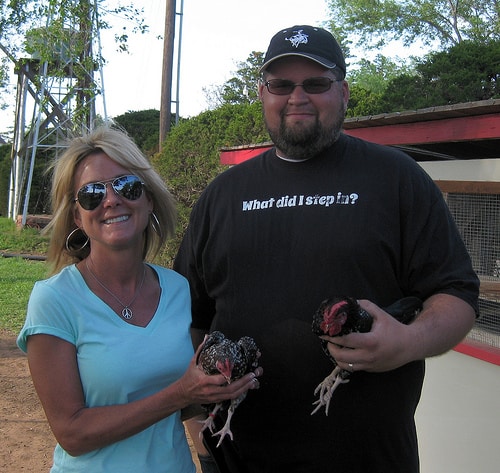 People holding chickens