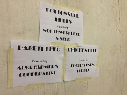 Signs recognize local business donors at the county fair. Photo by Becky McCray.