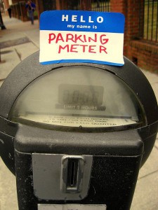 Parking meter with a sticker that says, Hello, my name is Parking Meter. Photo by Jonathan on Flickr. 