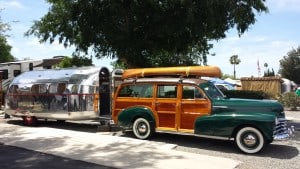 Woodie car and travel trailer.