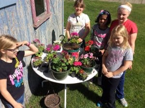 3rd & 4th girls planted flowers while the boys planted peas. Photo courtesy of Carmen Rath-Wald, North Dakota State University Extension Service