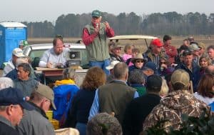 Crowd listening to the auctioneer at a farm auction