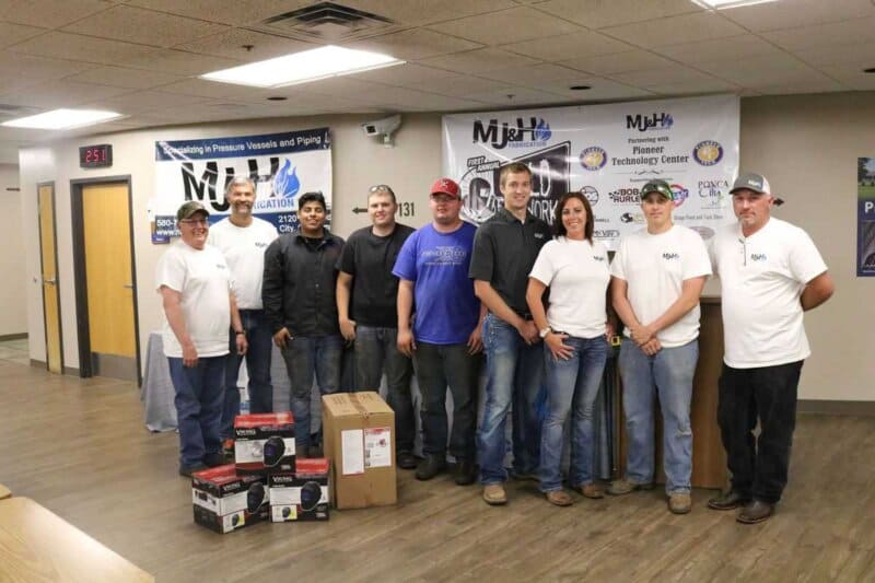 Winning welders pause for a photo