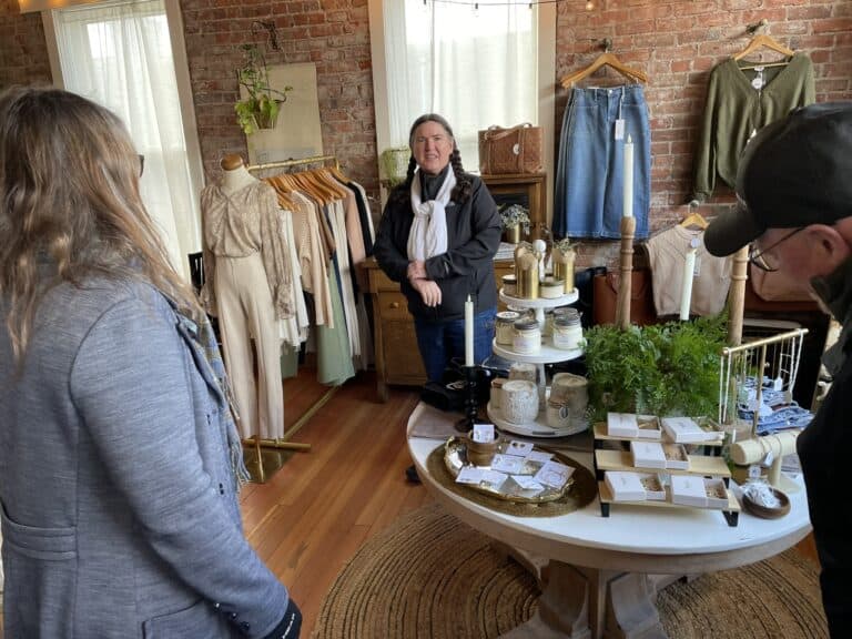 A few people shopping in an attractive retail store in refurbished downtown building.