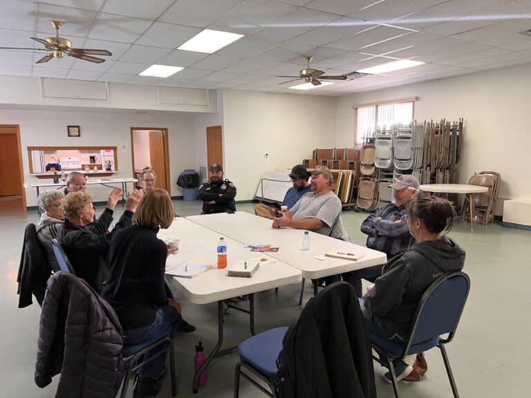 group of volunteers sitting at a table
